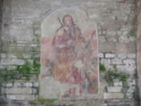 Un affresco sulle pareti della Basilica antica che raffigura una persona